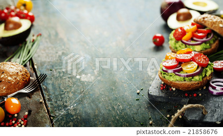 sandwiches with avocado, tomato, onion and pepper sandwiches with avocado, tomato, onion and pepper 21858676