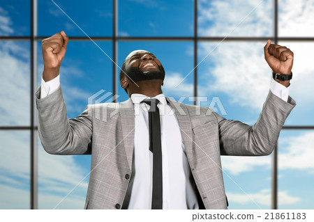 Cheerful afro businessman in jacket. Cheerful afro businessman in jacket. 21861183
