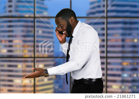 Smiling black man with phone. 21861271