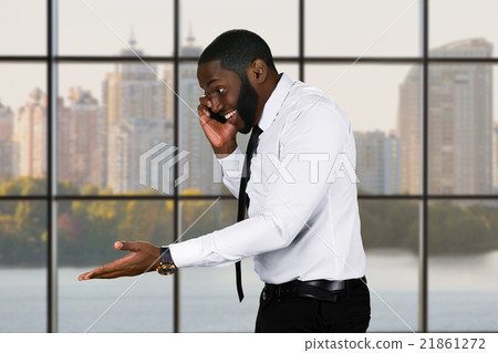 Friendly black guy with cellphone. 21861272