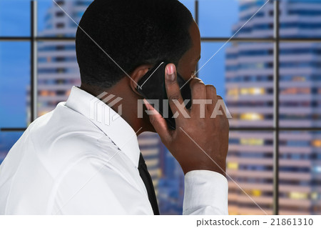 Afro man with mobile phone. Afro man with mobile phone. 21861310