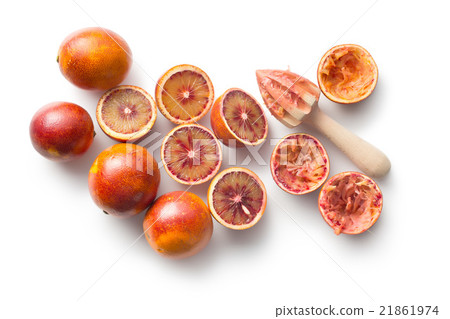 halved blood orange and juicer 21861974