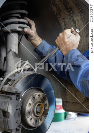 mechanic fixes brakes mechanic fixes brakes 21863377