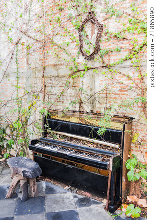 old piano with concrete wall and leaf old piano with concrete wall and leaf 21865890
