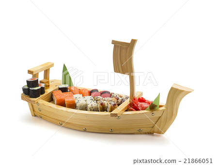 Sushi set on a wooden plate isolated 21866051