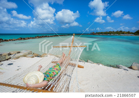 Woman relaxing in a hammock 21866507
