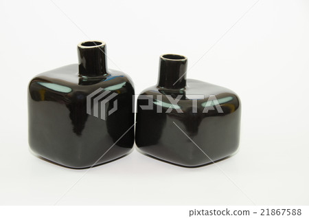 Two black bottles. Two black bottles. 21867588