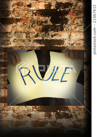 People hand hold torn sign with tex rule  21867615