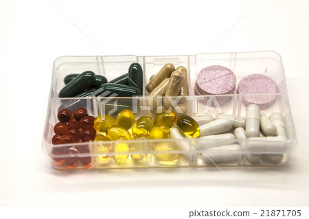 Different pills in the box for drugs closeup  21871705