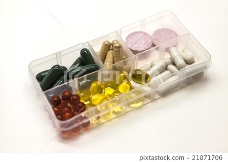 Different pills in the box for drugs closeup 21871706