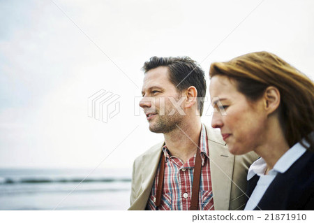 Foreign tourists walking along the beach Foreign tourists walking along the beach 21871910
