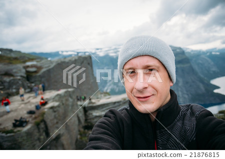 Young Tourist Taking Selfie Against The Backdrop 21876815