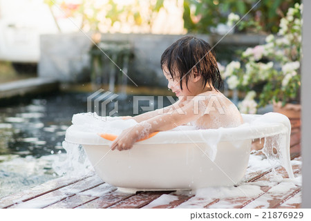Cute asian child bathing in the garden Cute asian child bathing in the garden 21876929