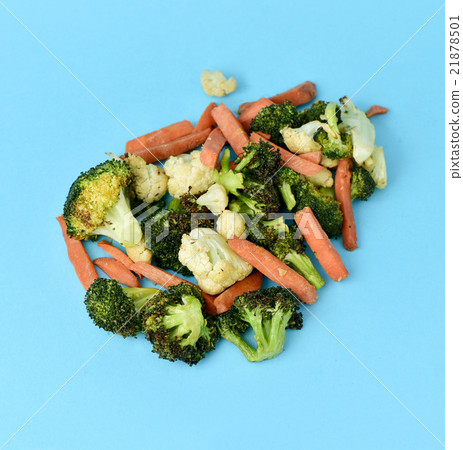 sauteed vegetables on a blue background sauteed vegetables on a blue background 21878501