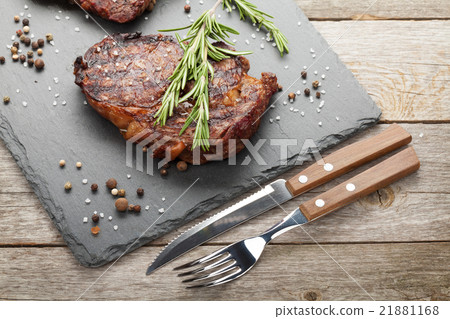 Beef steaks with rosemary and spices Beef steaks with rosemary and spices 21881168