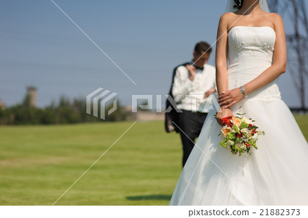 Beautiful bride with bouquet of flowers Beautiful bride with bouquet of flowers 21882373