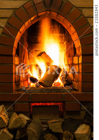 firewood and fire in fireplace 21882843