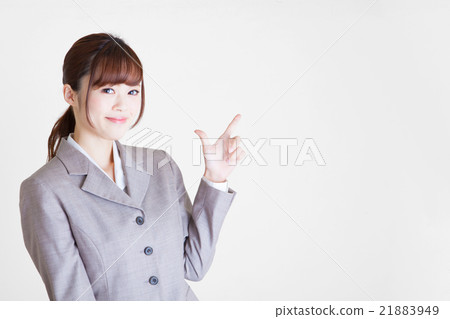 A young woman with a pointing female suits copy space 21883949