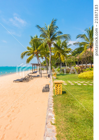 Beautiful beach and sea with palm tree Beautiful beach and sea with palm tree 21887183