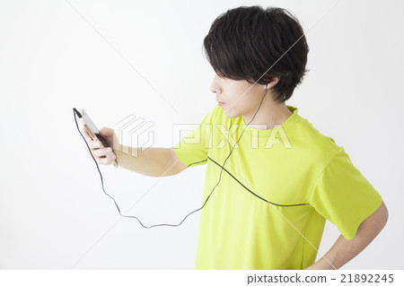 A man who runs while listening to music A man who runs while listening to music 21892245
