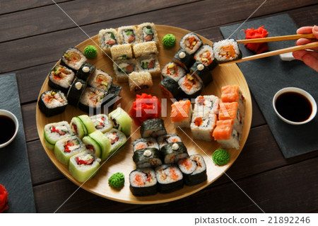 Set of sushi maki and rolls at black rustic wood. 21892246
