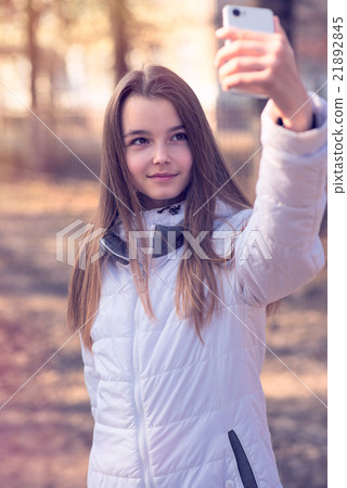 Beautiful girl takes a picture of the self Beautiful girl takes a picture of the self 21892845