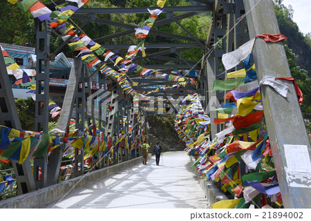 travelers are walking through bridge to Poon Hill 21894002