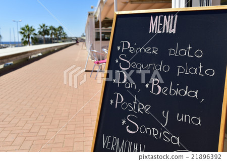 chalkboard menu in a coastal city in Spain 21896392