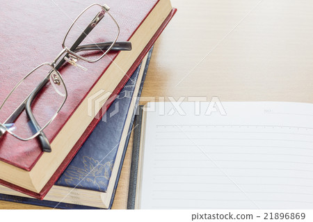 Eyeglasses and Notebook open blank page 21896869