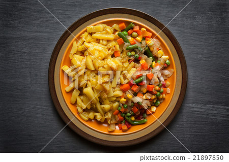 Fried potato with vegetables on plate Fried potato with vegetables on plate 21897850