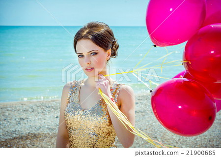 woman with balloons on the sea 21900685