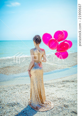 woman with balloons on the sea woman with balloons on the sea 21900687
