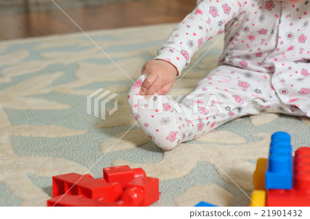 Cute baby playing on floor. Cute baby playing on floor. 21901432