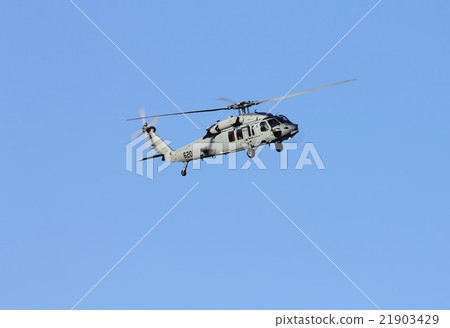 U.S. Navy flying helicopter MH-60S Nighthawk flying against the clear sky blue sky U.S. Navy flying helicopter MH-60S Nighthawk flying against the clear sky blue sky 21903429
