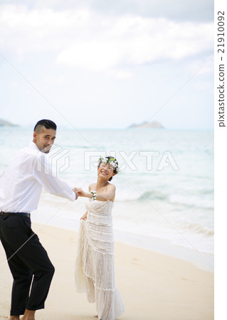 Bride and grooming beach wedding 21910092