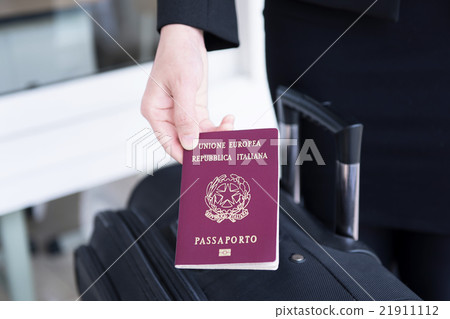 Hand holding Italy passport, ready to travel Hand holding Italy passport, ready to travel 21911112