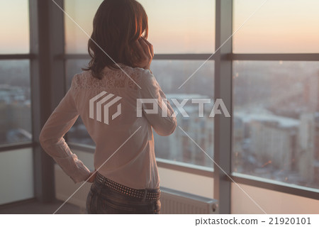 Rear view portrait of young worker speaking using 21920101