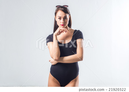 Beautiful young model posing, touching her chin Beautiful young model posing, touching her chin 21920322
