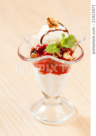 ice cream with fruit sauce ice cream with fruit sauce 21923971