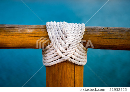 white rope wood cross on blue white rope wood cross on blue 21932323