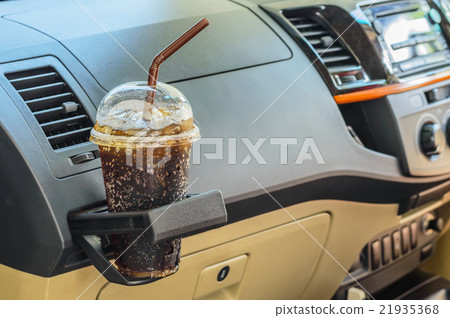 Bottle with cola in a car interior. 21935368
