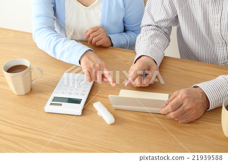 Hand of elderly couple consulting households 21939588