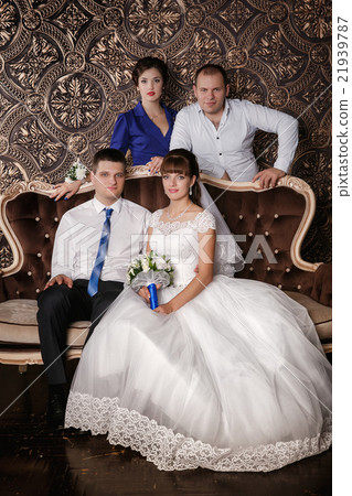 Happy groom, bride, groomsman, bridesmaid  21939787