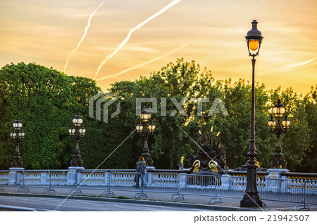 lone passerby on Alexander III bridge at dawn lone passerby on Alexander III bridge at dawn 21942507