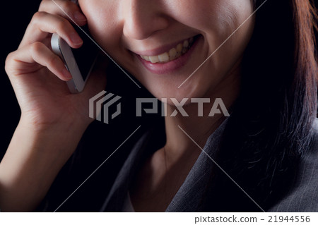 Business woman making a phone call, malice Business woman making a phone call, malice 21944556