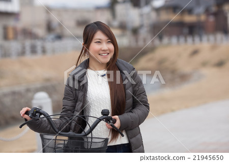 A young woman cycling A young woman cycling 21945650