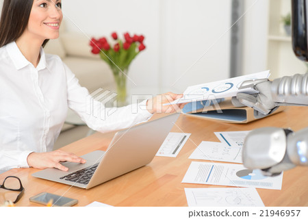 Pleasant girl working at the table 21946957