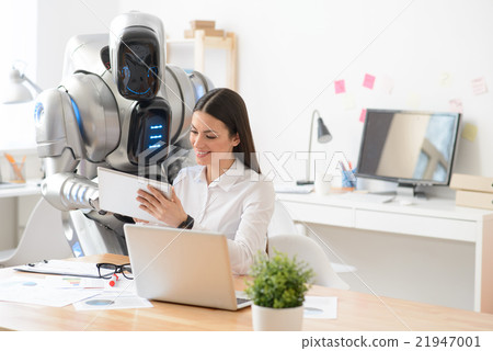 Pleasant girl and robot using tablet  21947001