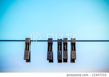 The old Clothespins on the rope. 21947310