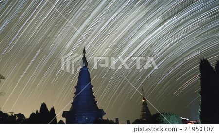 view of buddhist pagoda and startrail in galaxy view of buddhist pagoda and startrail in galaxy 21950107